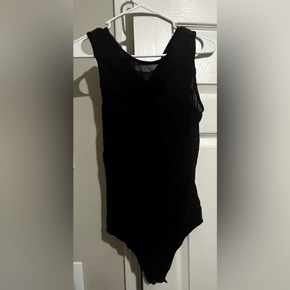 One piece embroidered top.